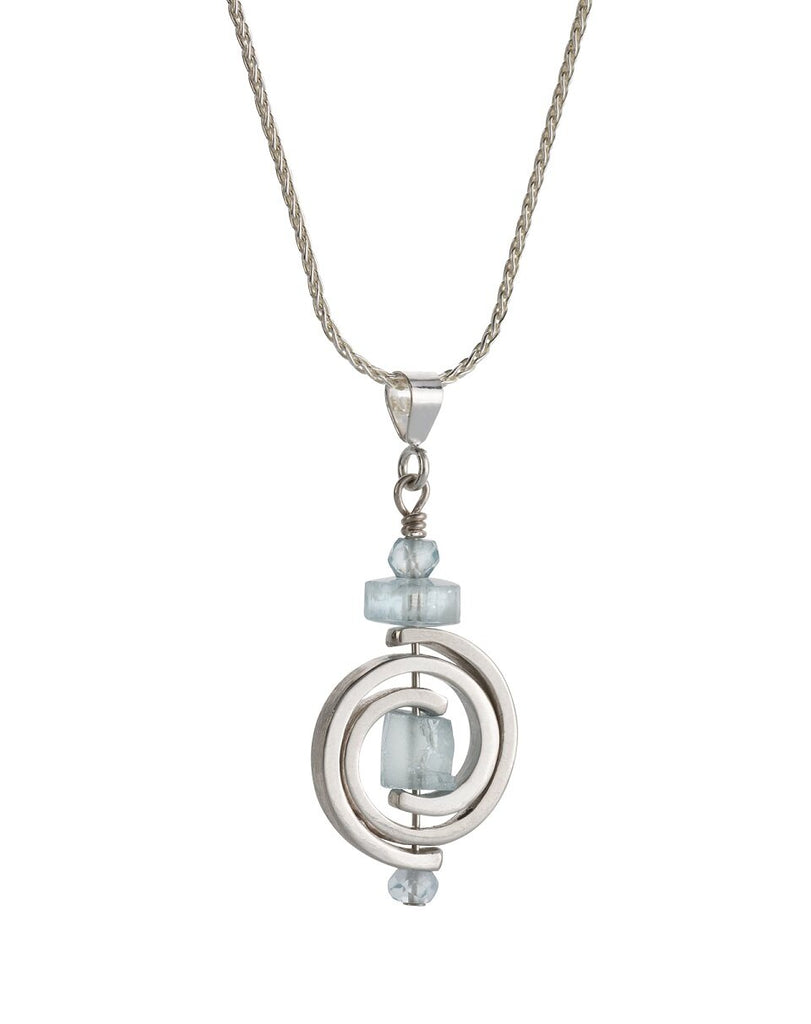 Small Pendant with aquamarines, hanging from a silver necklace.