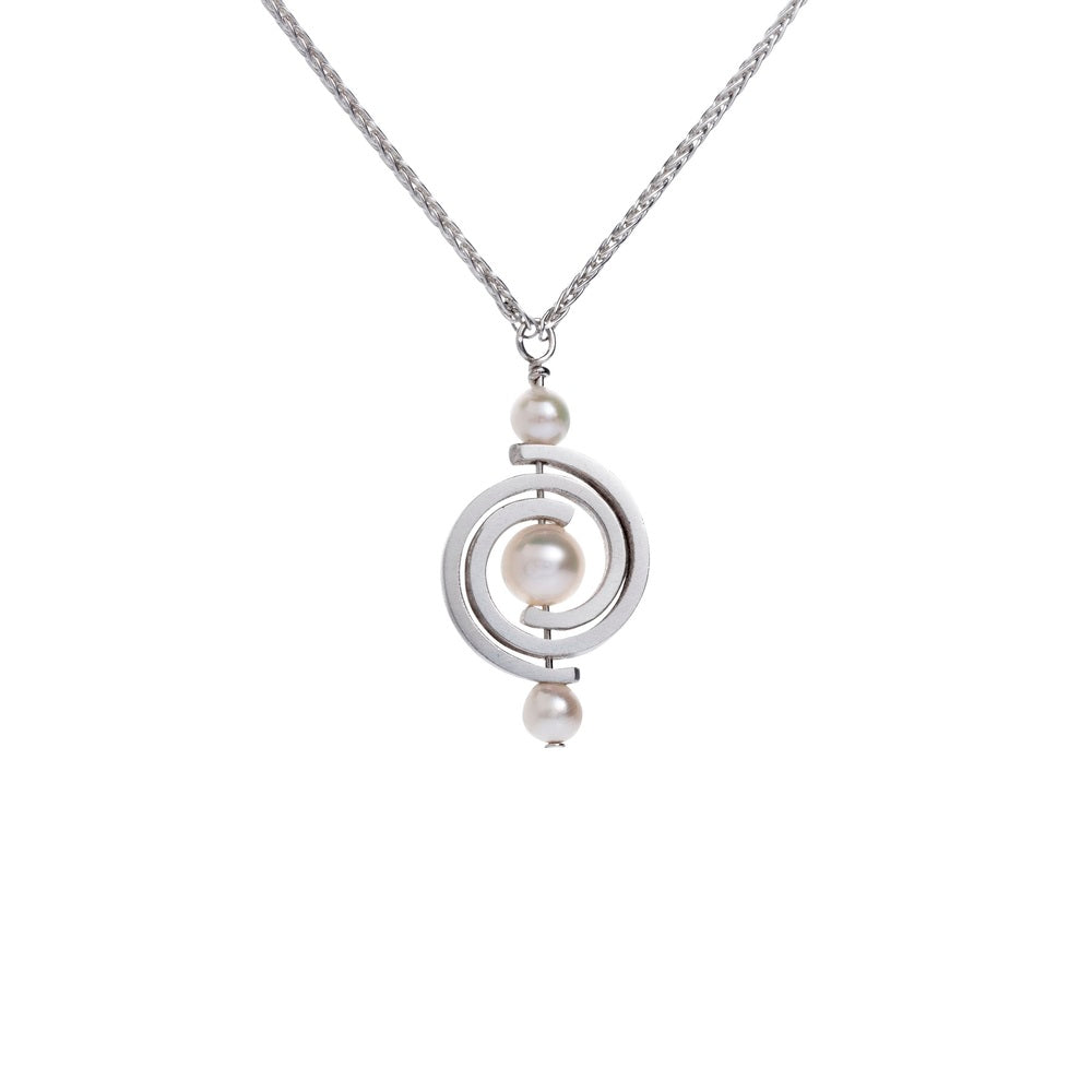 Small hanging pendant with 3 Akoya pearls and interlocking spirals from the Orbit collection.